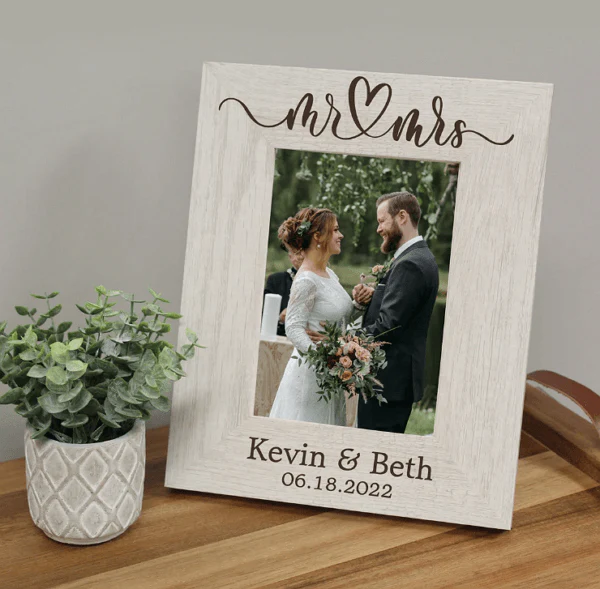 Laser engraved wood photo frame with Mr and Mrs, the couple's names and wedding date